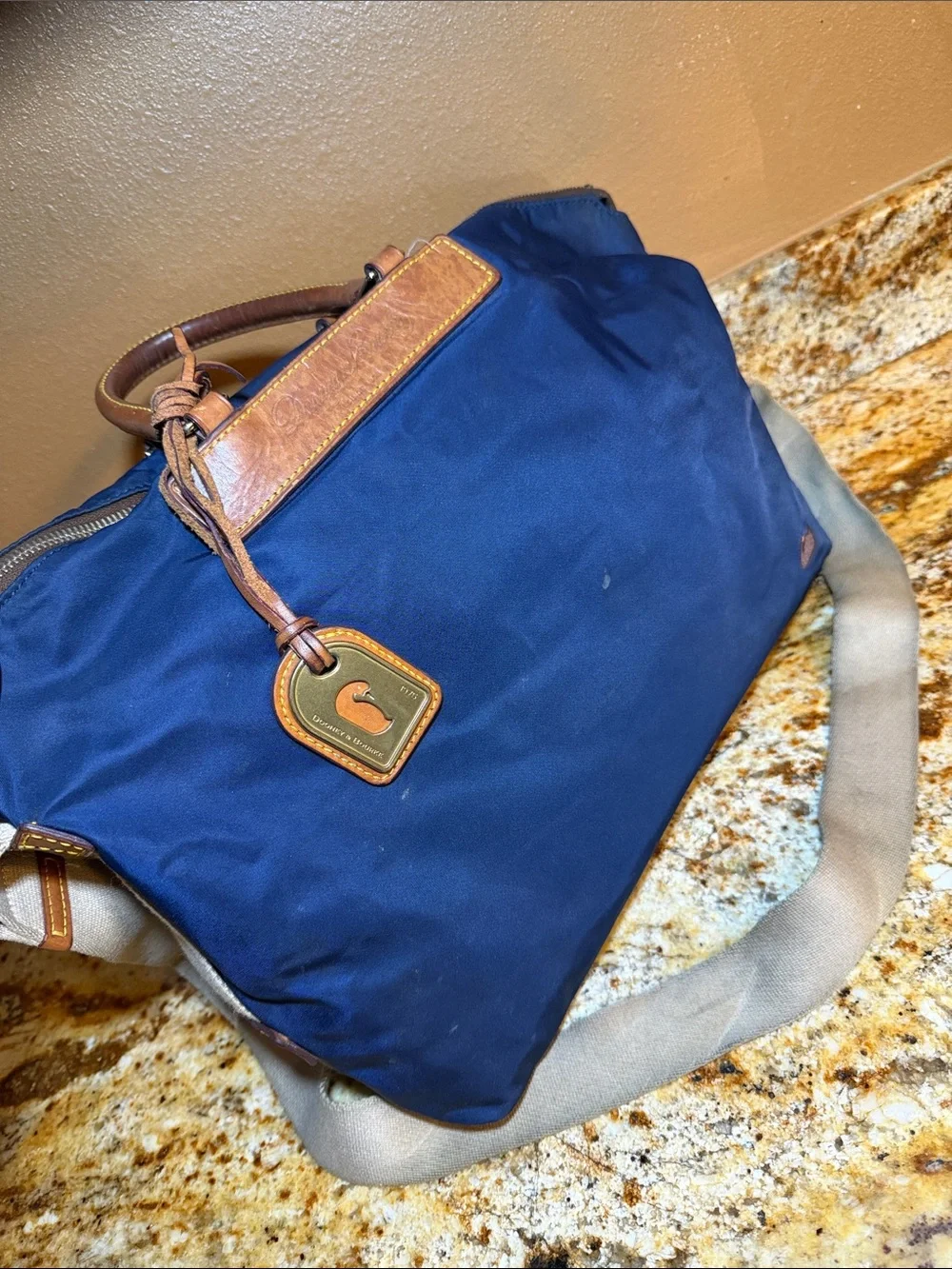 Dooney & Bourke Navy Nylon Messenger Bag with Tan Leather Trim
